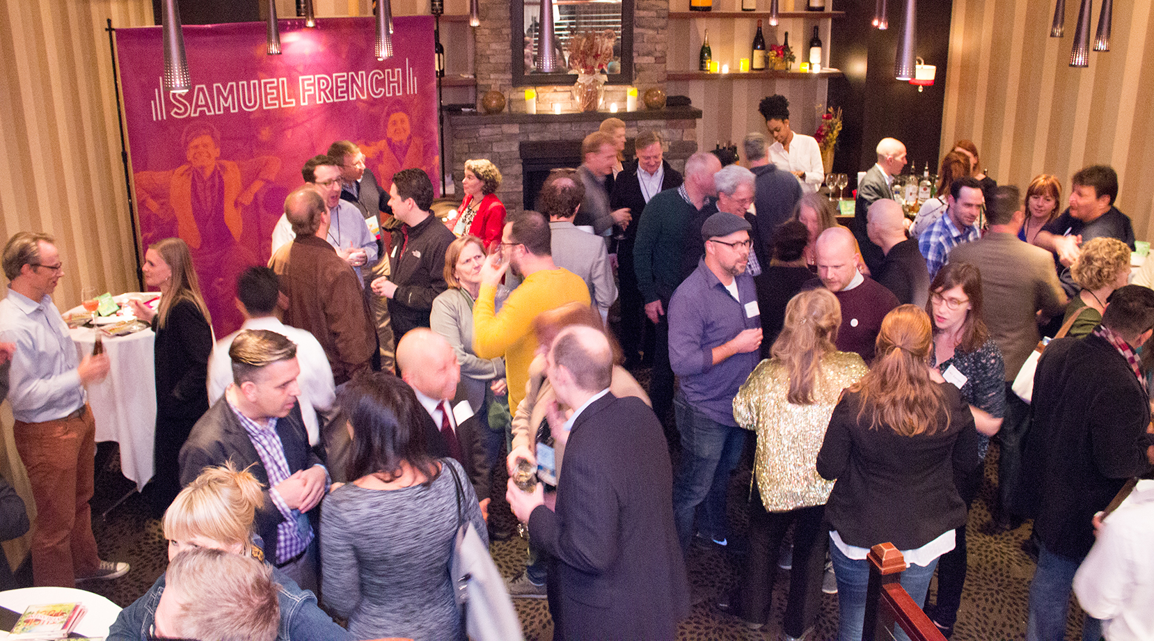 Members and guests network and enjoy the open bar at Glass House Tavern