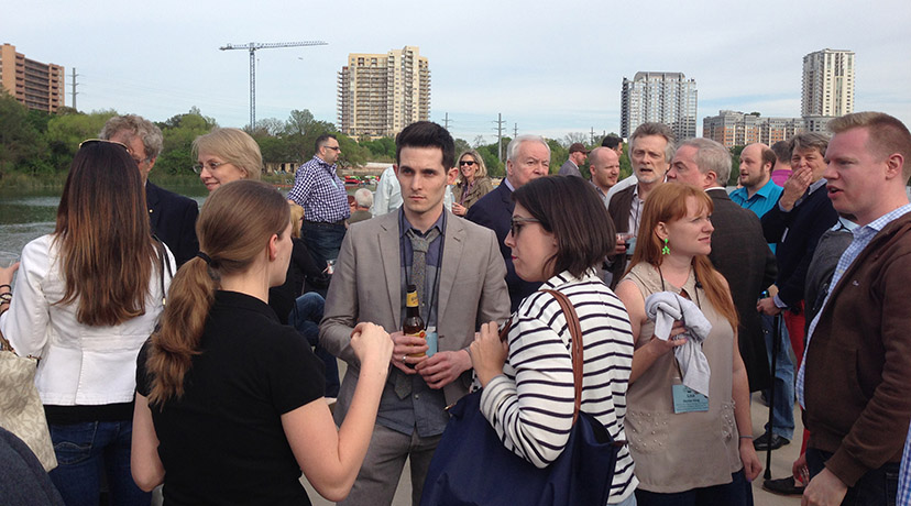 Attendees network and take in Austin from a boat on Lady Bird Lake