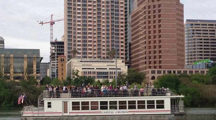 Attendees embark on a Sunset Cocktail Cruise around Austin on Lady Bird Lake